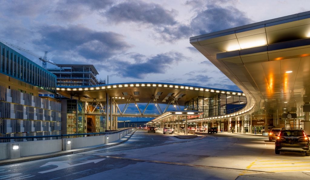 BNA - Nashville Airport 14 Nighttime exterior view of the curved terminal design at Nashville International Airport.