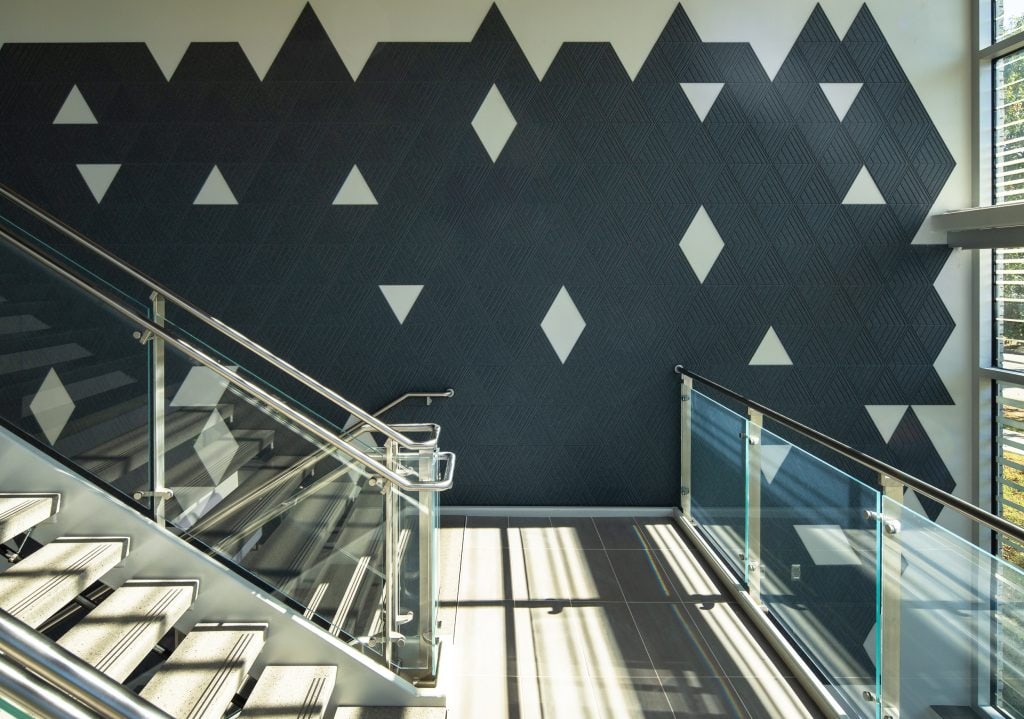 UKC COLDSTREAM 8 Architectural wall detail with geometric patterns and natural light.