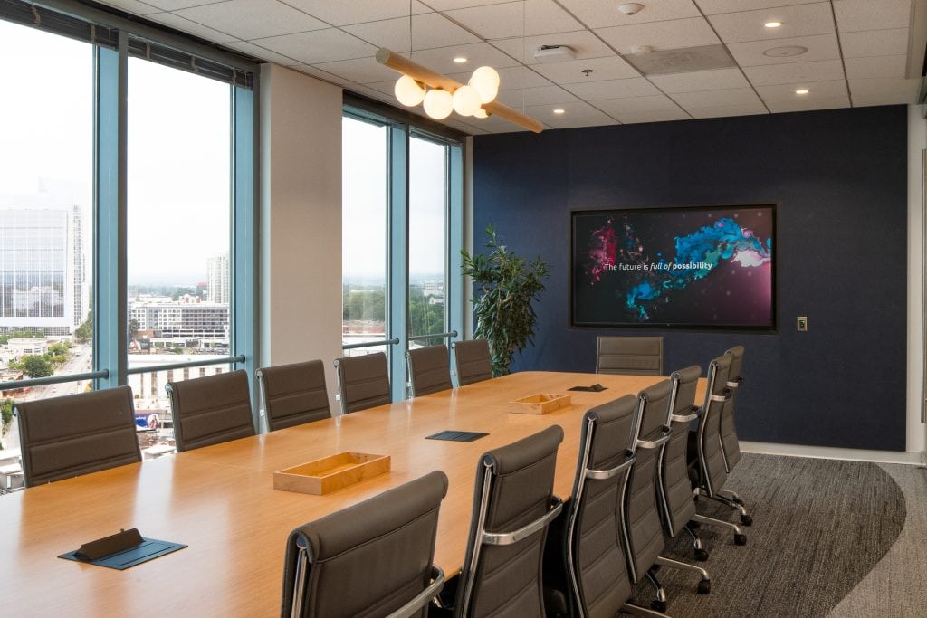 Capgemini Atlanta 4 Modern corporate boardroom with large windows and sleek chairs.