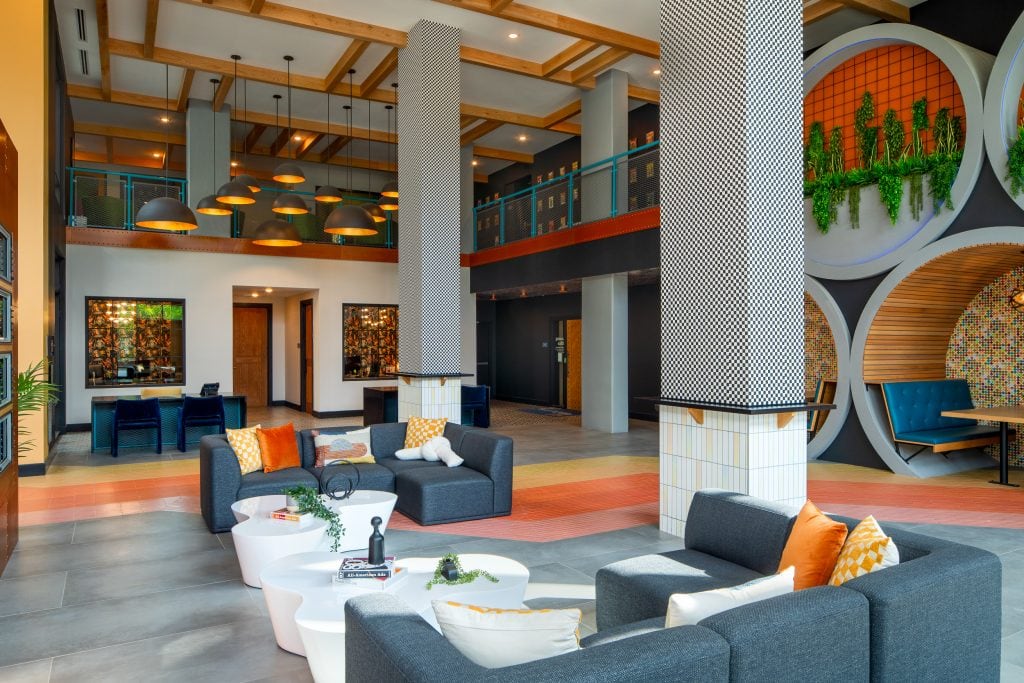 Broadstone Craft 3 Lobby with bold design elements, checkered columns, and barrel seating.
