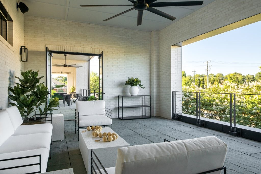 Brio 9 Elevated patio with modern seating and potted greenery.