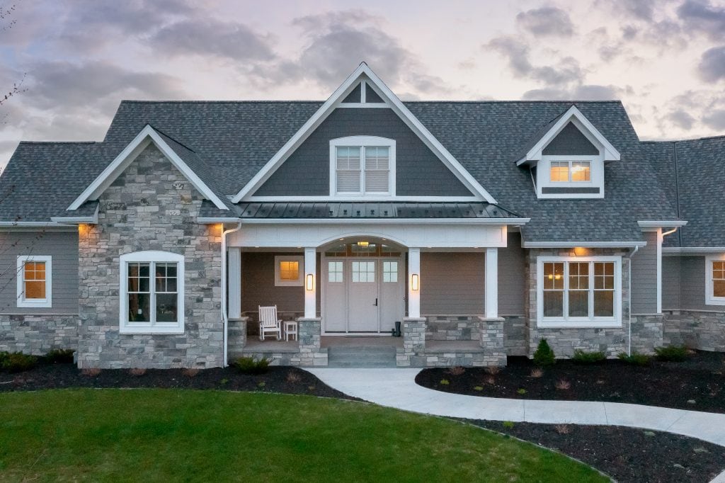 Crystal Lake 9 Front entrance with stone porch and landscaped yard.
