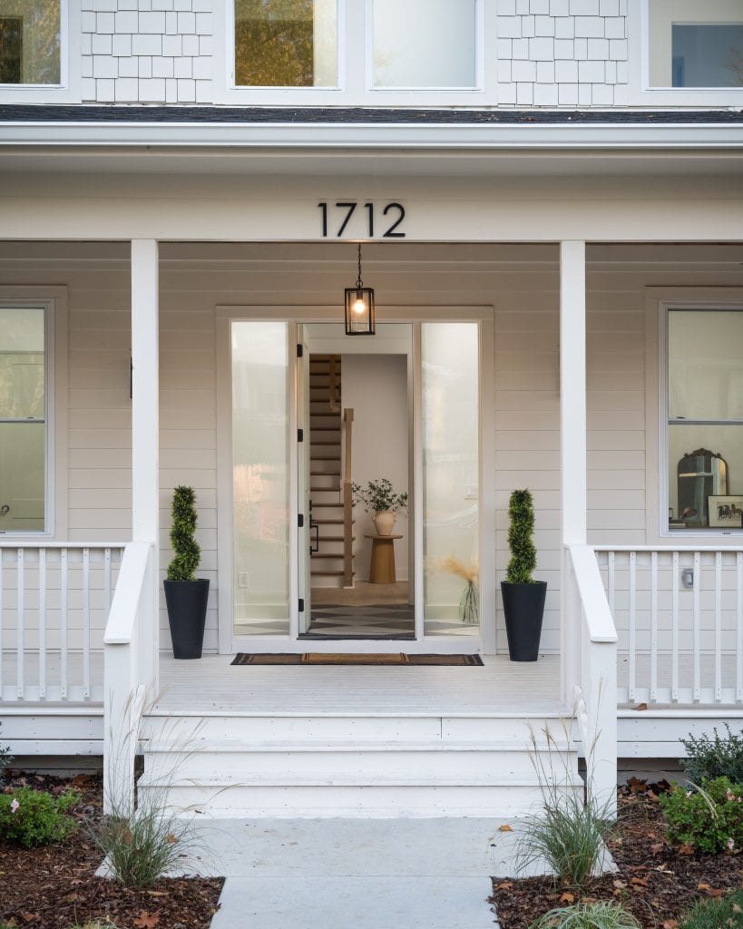 Eastside 10 Front porch with welcoming design and white siding.