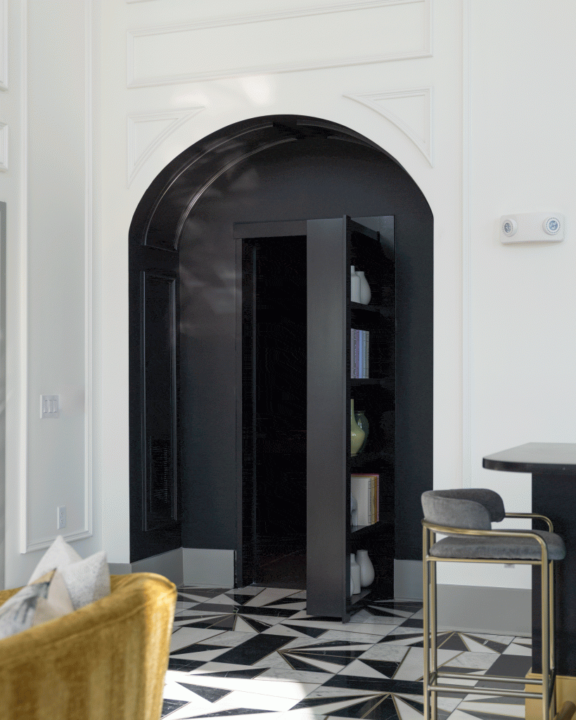 THE BOULEVARD 12 Hidden door in a luxury residential space, designed as a bookshelf, leading to a speakeasy in Charlotte.