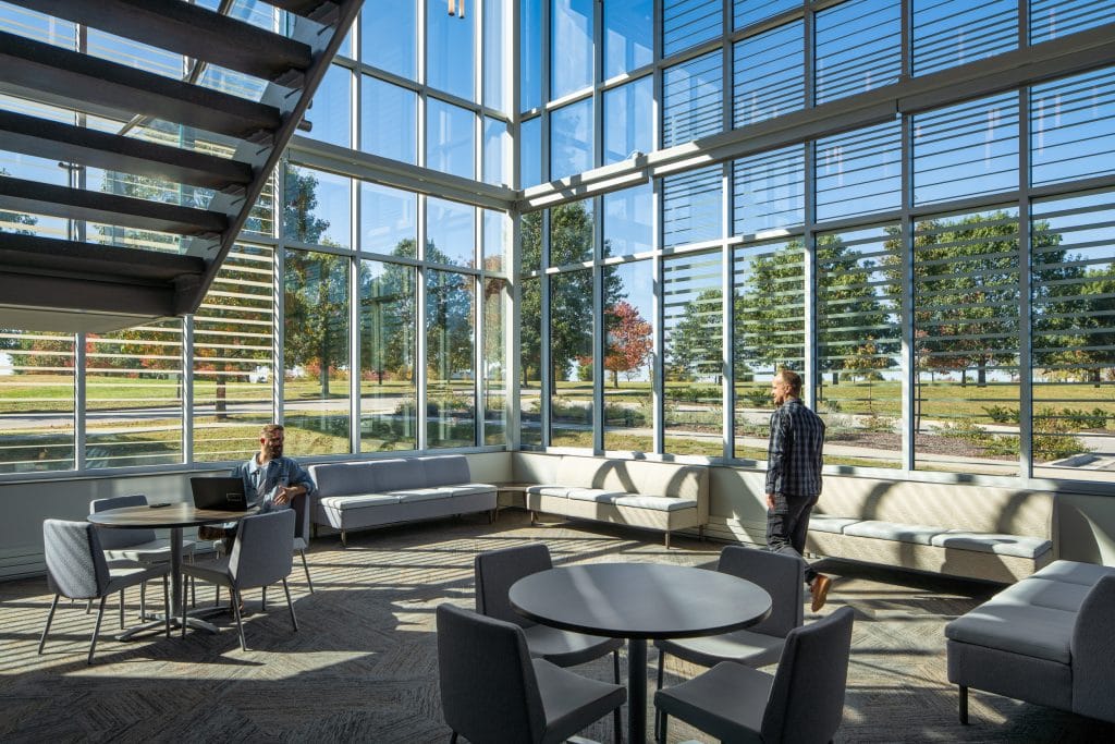 UKC COLDSTREAM 5 Interior commons area with large glass windows and natural light.