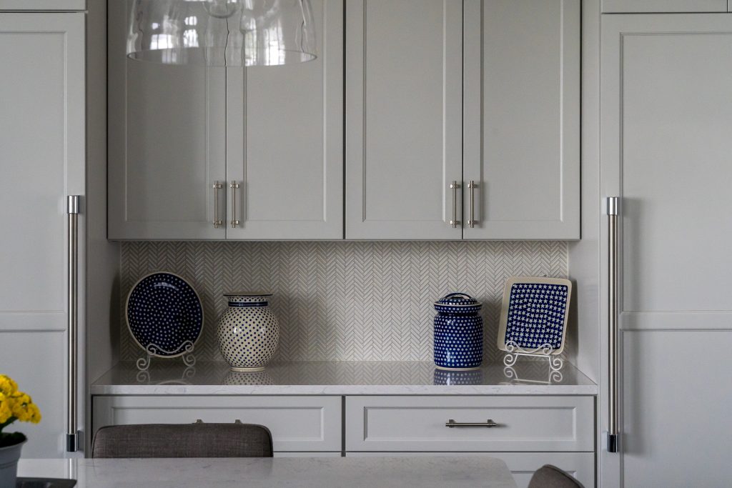 Crystal Lake 3 Kitchen cabinetry with chevron tile backsplash.