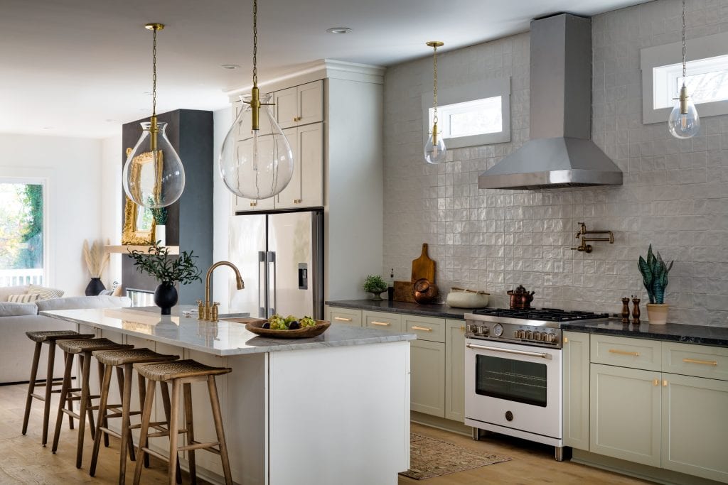 Eastside 1 Kitchen with brass pendants and marble island.