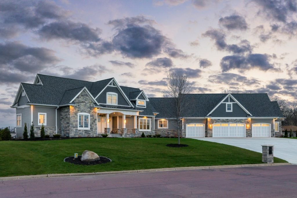 Crystal Lake 8 Lakefront home exterior at dusk with stone accents.