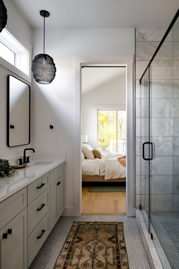 Eastside 5 Master bathroom with spacious shower and bedroom view.