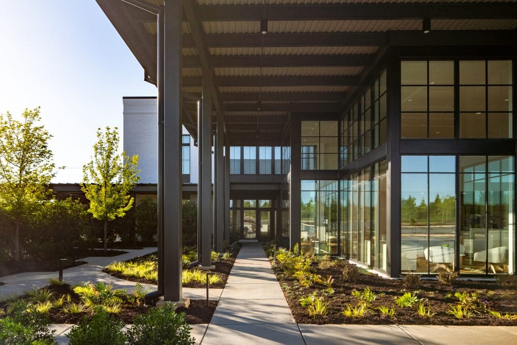 Brio 2 Building with glass walls and landscaped pathways in Greenville, SC.