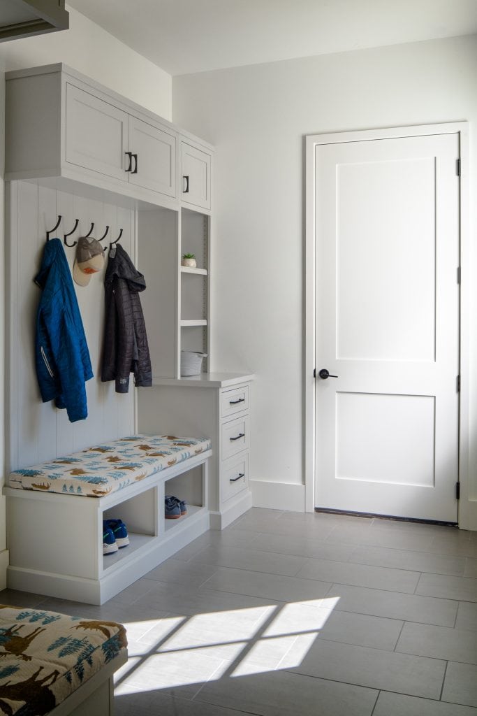 Flowering Vine 11 Mudroom with built-in storage, coat hooks, and a window letting in natural light.