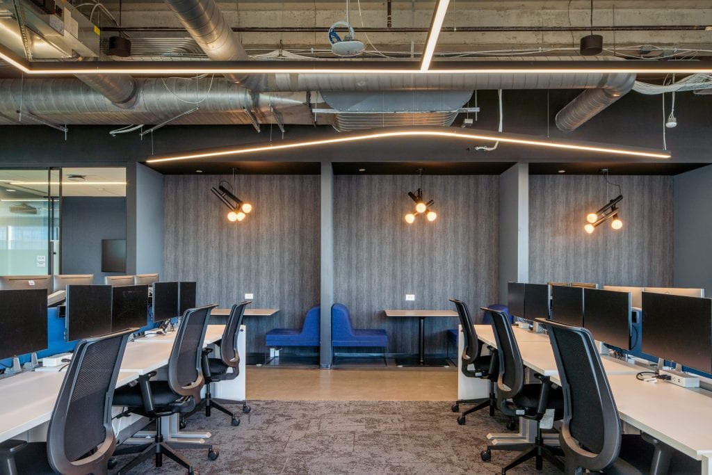 Capgemini Nashville 6 Open office area with modern workstations and creative lighting.