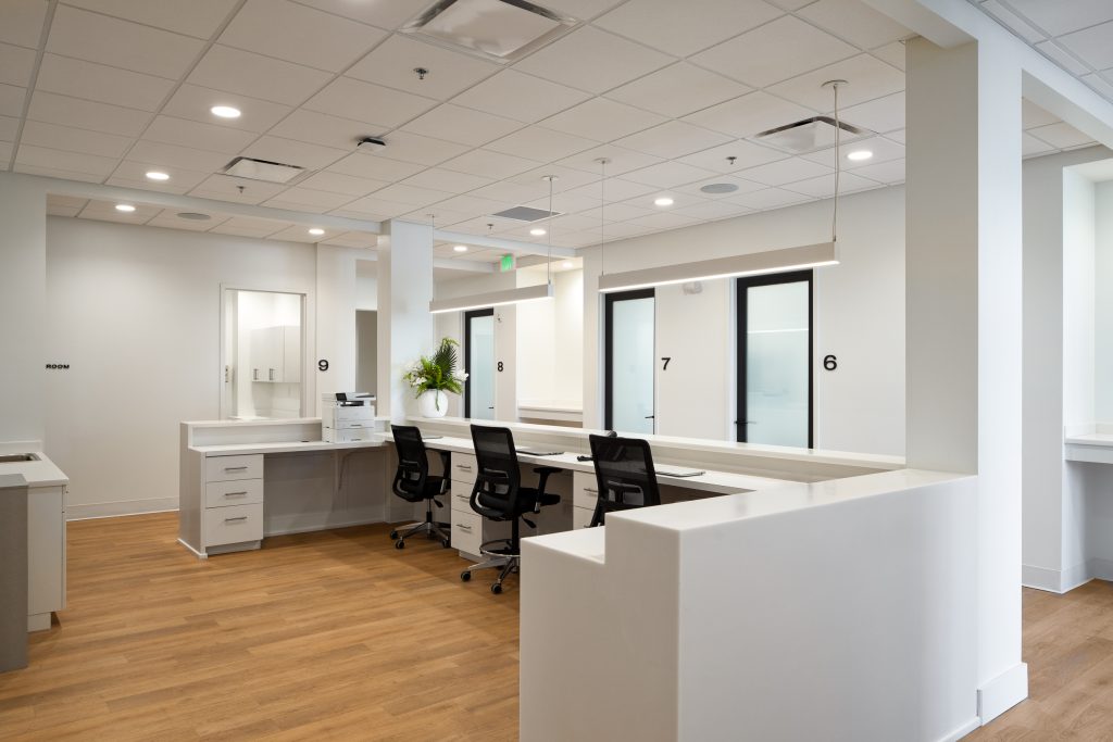 Brio 6 Open workspace with minimalist furniture and natural lighting.