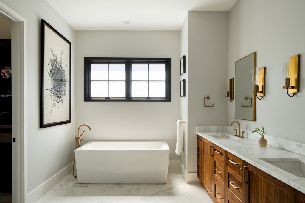 Flowering Vine 10 Bathroom with a freestanding tub, wooden vanity, and marble details.