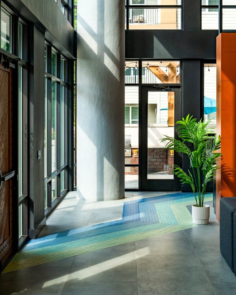 Broadstone Craft 2 Bright entryway with colorful tiles in a modern residential building.