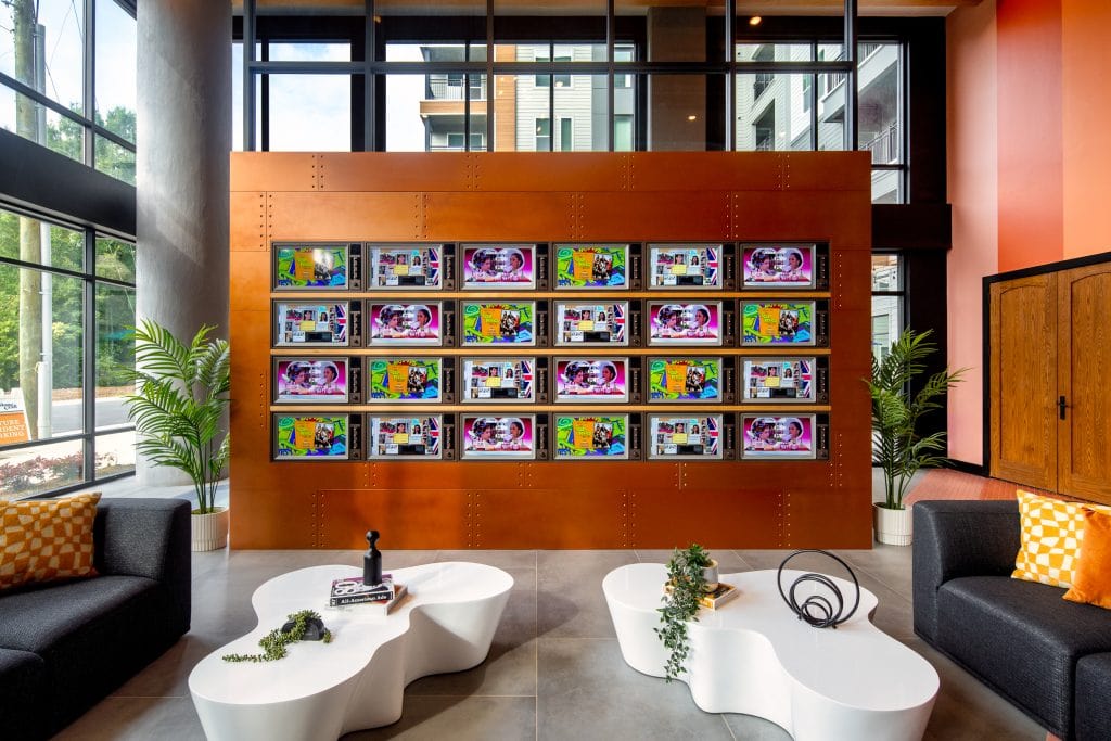 Broadstone Craft 4 Lobby TV wall with 80s-inspired visual content.