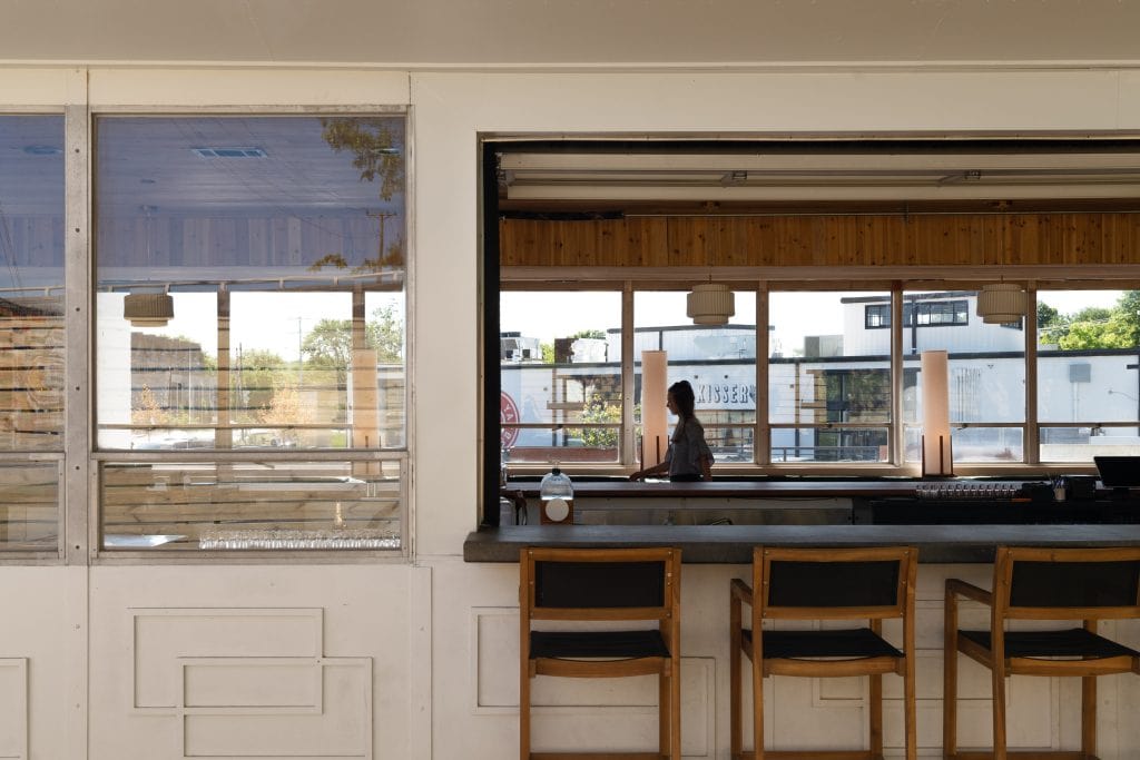 Golden Pony 15 View into the bar interior through an open garage-style window.