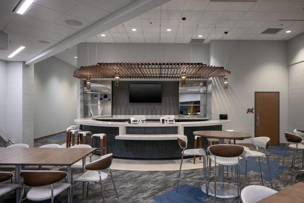 FM Bank Arena 13 Exclusive arena lounge featuring upscale seating and lighting.