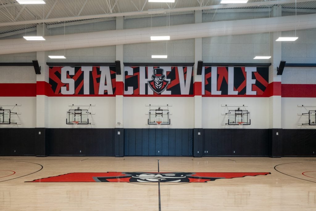 FM Bank Arena 6 Gymnasium walls featuring bold murals and team colors.