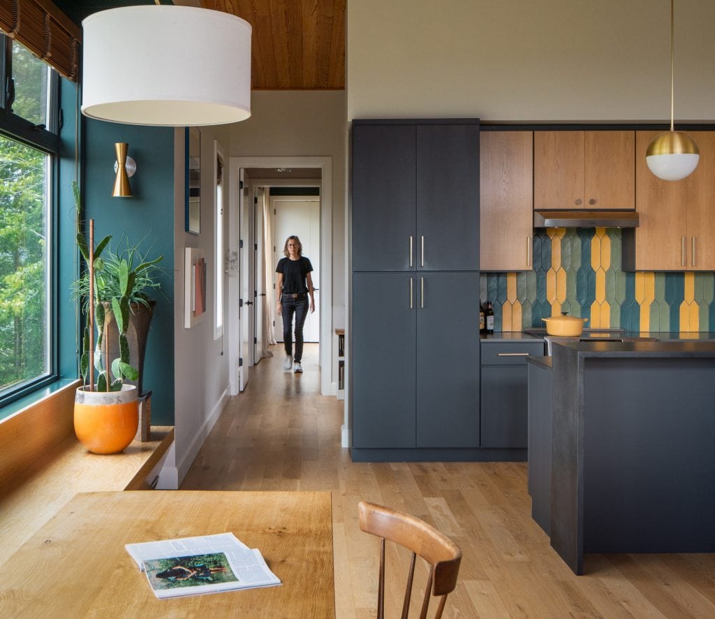 Freedom Cove 5 Open kitchen with dark cabinetry and a warm wood interior.