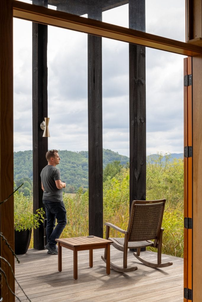 Freedom Cove 9 Covered porch with wooden rocking chairs overlooking mountain views.