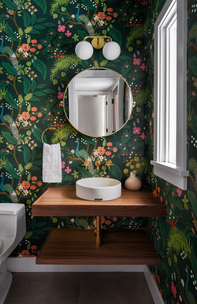MINOR PARK MODERN 10 A powder room with bold wallpaper and a floating wood vanity.