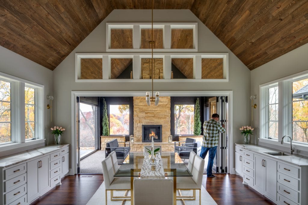 Marie 12 Dining space with an open-concept kitchen, white cabinets, and stylish decor.