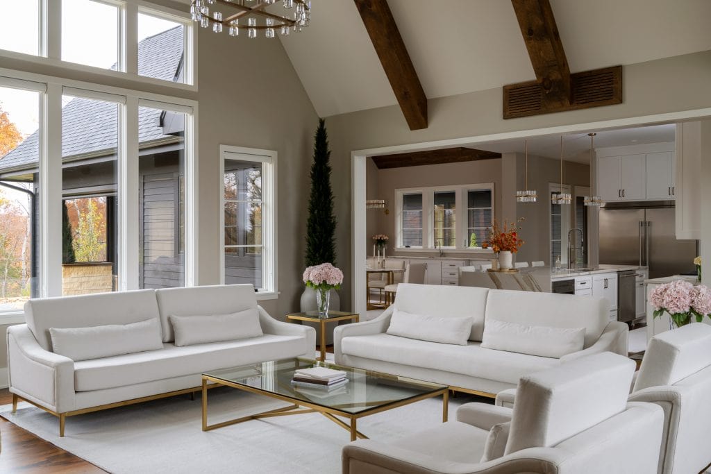 Marie 10 Open-concept living space with modern furnishings, neutral tones, and large windows.