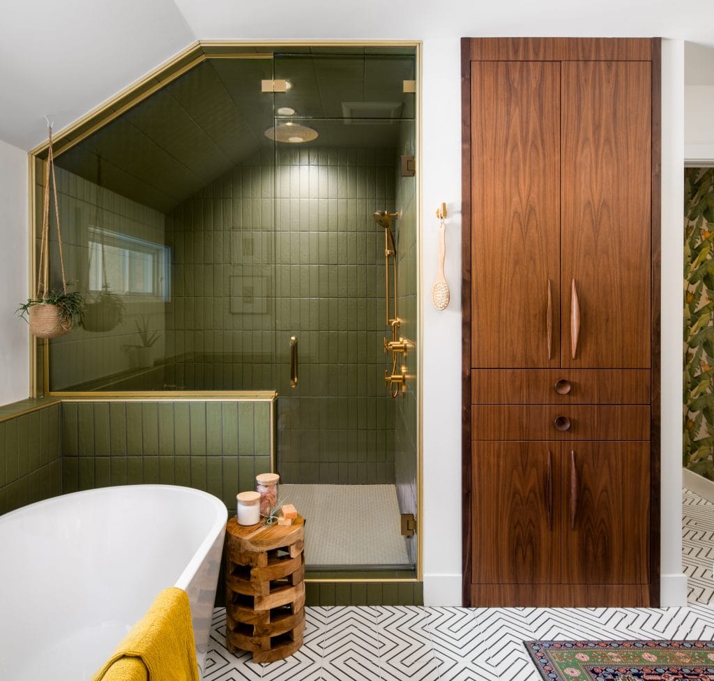 MINOR PARK MODERN 13 A bathroom with a green-tiled shower and walnut cabinetry.