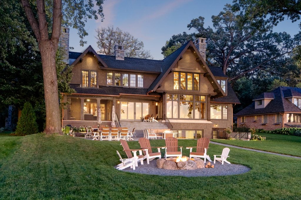 LAKE POLASKI 10 Outdoor firepit with Adirondack chairs behind Craftsman-style home